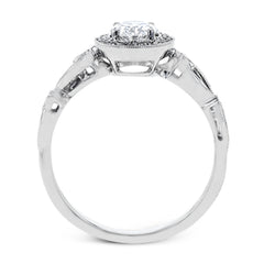 Reflecting a lovely romantic design, this white gold classic engagement ring features .16 ctw round cut white diamond accents.