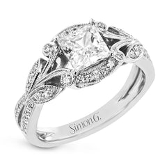 This amazing 18k white gold engagement ring features vintage-inspired design elements set with .28 ctw of white diamonds.