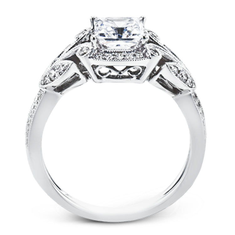 This amazing 18k white gold engagement ring features vintage-inspired design elements set with .28 ctw of white diamonds.