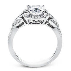 This amazing 18k white gold engagement ring features vintage-inspired design elements set with .28 ctw of white diamonds.