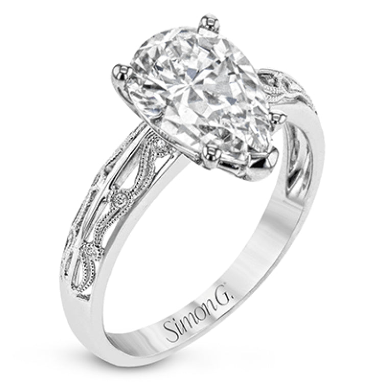 A whimsical openwork design glimmers with .04 ctw of round white diamonds in this charmingly beautiful white gold engagement ring.