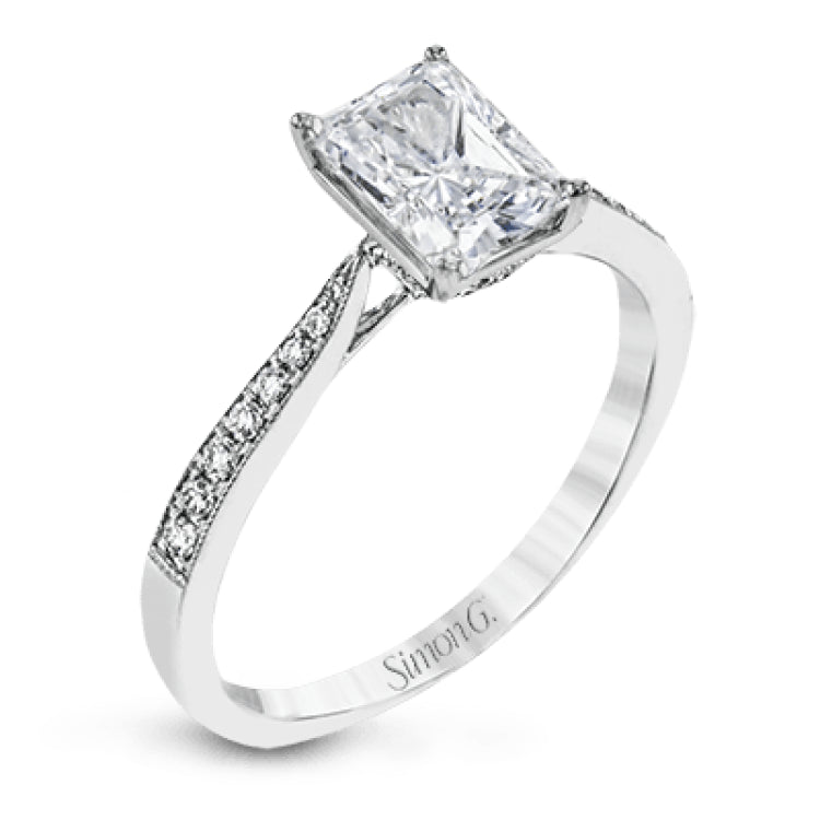 The delicate, understated design of this lovely white gold ring is elevated by .27 ctw of round white diamond accents.
