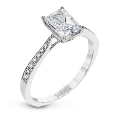 The delicate, understated design of this lovely white gold ring is elevated by .27 ctw of round white diamond accents.