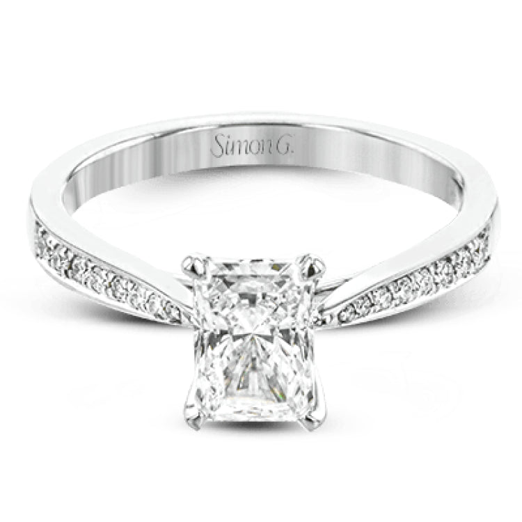 The delicate, understated design of this lovely white gold ring is elevated by .27 ctw of round white diamond accents.