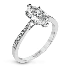 The delicate, understated design of this lovely white gold ring is elevated by .27 ctw of round white diamond accents.