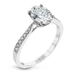 The delicate, understated design of this lovely white gold ring is elevated by .27 ctw of round white diamond accents.