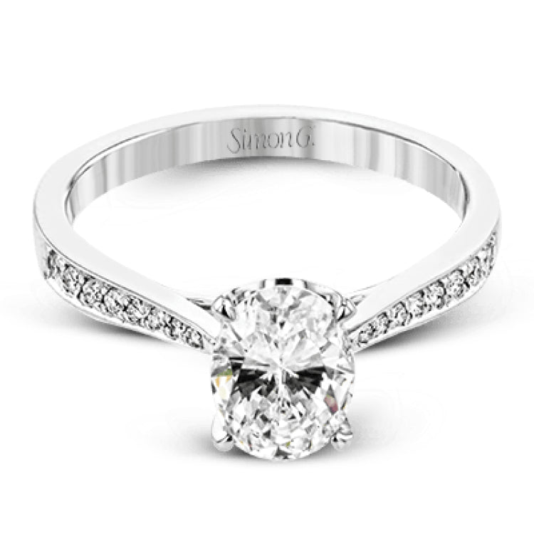 The delicate, understated design of this lovely white gold ring is elevated by .27 ctw of round white diamond accents.