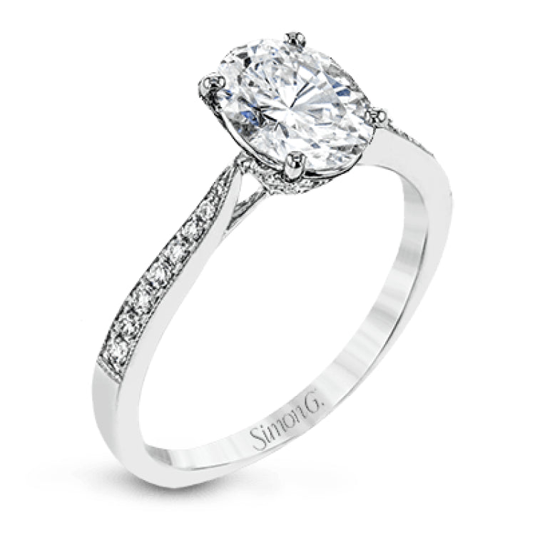 The delicate, understated design of this lovely white gold ring is elevated by .27 ctw of round white diamond accents.