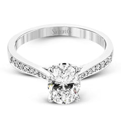 The delicate, understated design of this lovely white gold ring is elevated by .27 ctw of round white diamond accents.