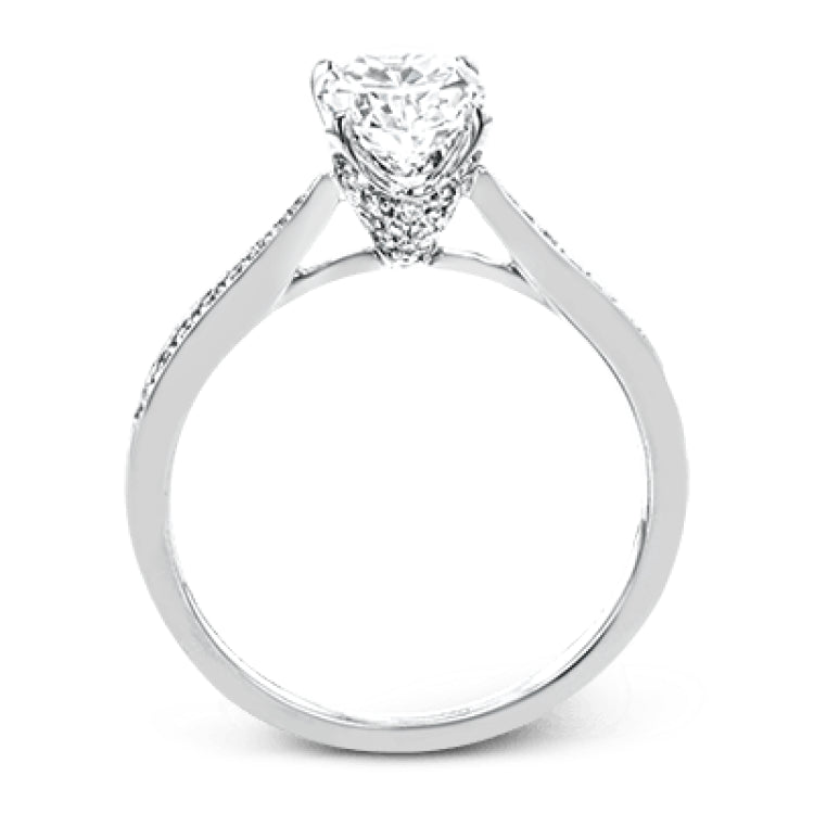 The delicate, understated design of this lovely white gold ring is elevated by .27 ctw of round white diamond accents.