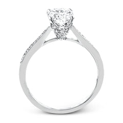 The delicate, understated design of this lovely white gold ring is elevated by .27 ctw of round white diamond accents.