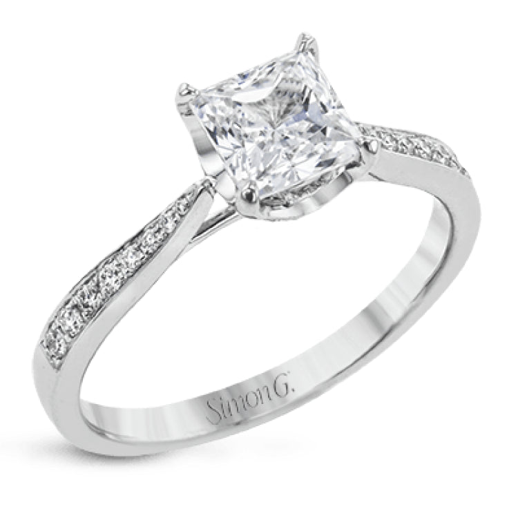 The delicate, understated design of this lovely white gold ring is elevated by .27 ctw of round white diamond accents.