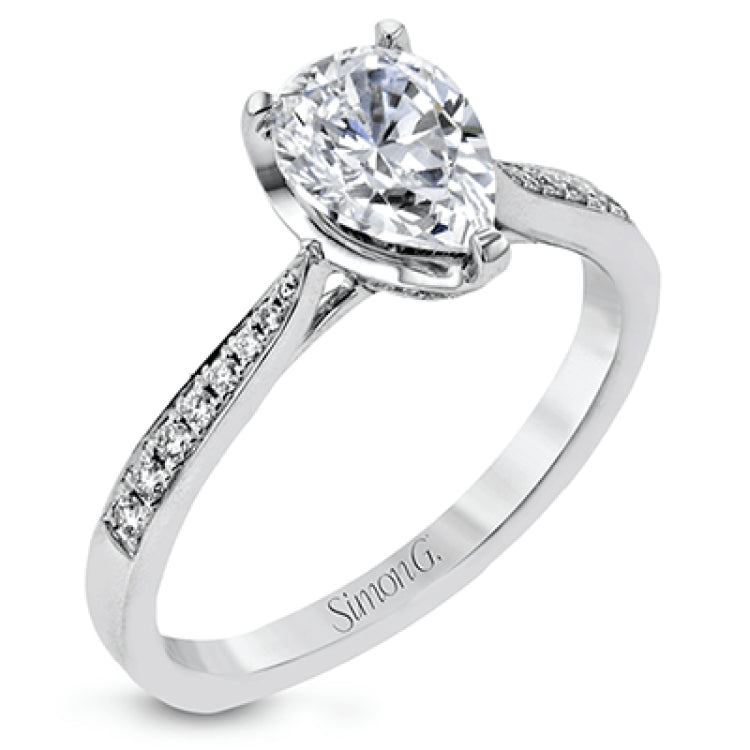 The delicate, understated design of this lovely white gold ring is elevated by .27 ctw of round white diamond accents.