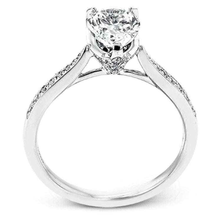The delicate, understated design of this lovely white gold ring is elevated by .27 ctw of round white diamond accents.