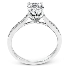 The delicate, understated design of this lovely white gold ring is elevated by .27 ctw of round white diamond accents.