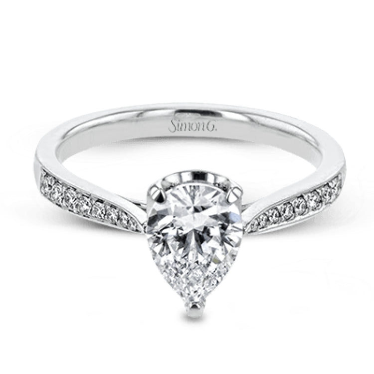 The delicate, understated design of this lovely white gold ring is elevated by .27 ctw of round white diamond accents.