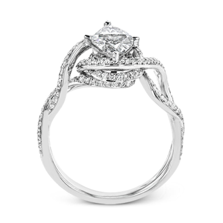 Classic with a modern twist, this white gold engagement ring features .50 ctw of sparkling white diamonds in a dramatic openwork design.