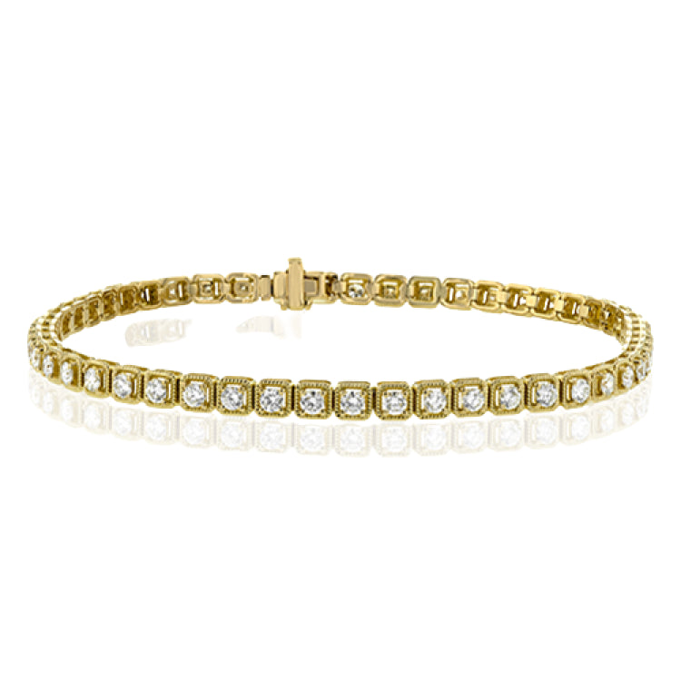 A modern take on a stackable diamond tennis bracelet, this timeless yellow gold design is setting with a total of 2.00 ct of white diamonds.