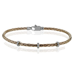 This easy-to-wear bracelet features three white gold stations set with .10ctw of diamonds set in a woven braid of 18k rose gold.