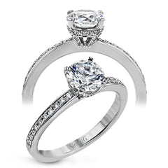 18K white gold engagement ring featuring .22cttw diamonds.  (center stone sold separately)