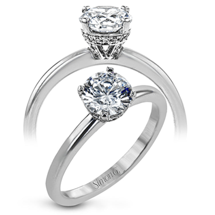 18K white gold solitare featuring .07cttw diamond underhalo.  (center stone sold separtately)