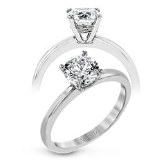 This singular engagement accents the center stone with a touch of .03 ctw of diamonds around the secure basket setting, while the band shines in high polish metal.