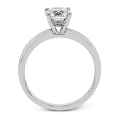 This singular engagement accents the center stone with a touch of .03 ctw of diamonds around the secure basket setting, while the band shines in high polish metal.