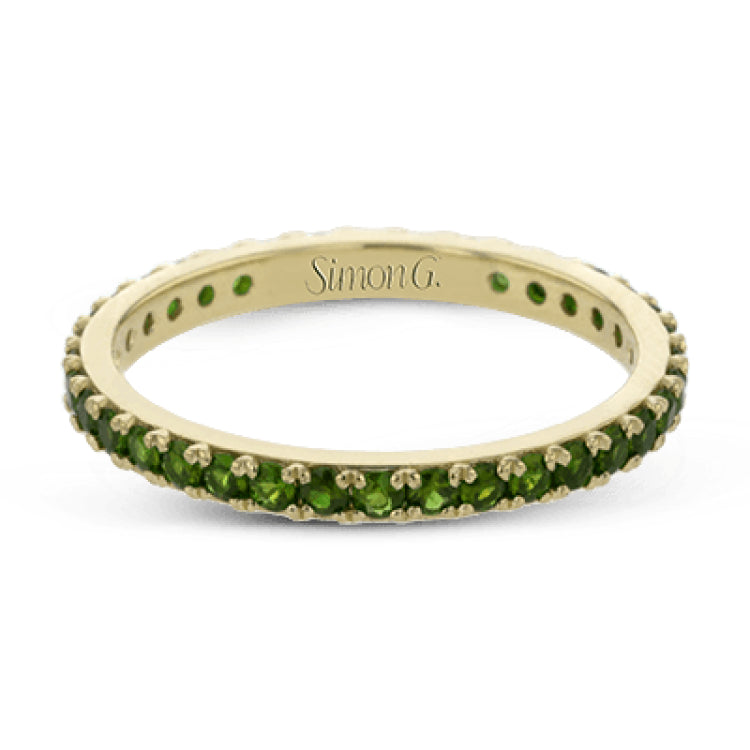 This simple 18k band adds a perfect touch of color with .38 ctw of emeralds.