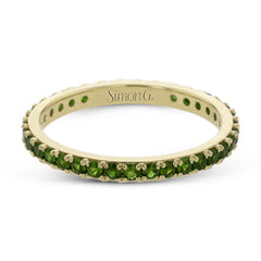 This simple 18k band adds a perfect touch of color with .38 ctw of emeralds.