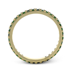 This simple 18k band adds a perfect touch of color with .38 ctw of emeralds.
