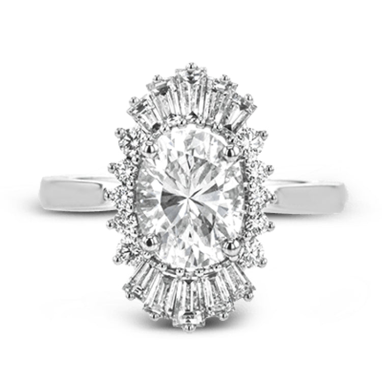 This stunning 18K WG engagement ring is inspired by a ballerinas skirt and features 0.21 ctw RD diam and 0.62 ctw of baguettes, surrounding the center
