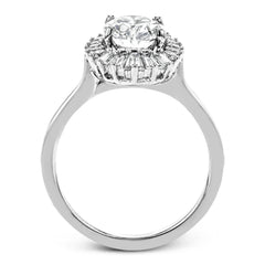 This stunning 18K WG engagement ring is inspired by a ballerinas skirt and features 0.21 ctw RD diam and 0.62 ctw of baguettes, surrounding the center