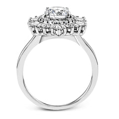 Crafted from 18k gold, this halo ring features a stunning .36 ctw of round diamonds and .49 ctw of baguette shaped diamonds.