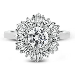 Crafted from 18k gold, this halo ring features a stunning .36 ctw of round diamonds and .49 ctw of baguette shaped diamonds.