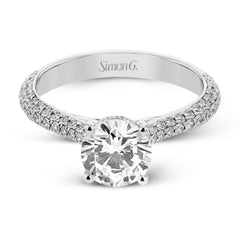 This stunning 18K engagement ring has pave set diamonds of 0.66 ctw., on all 3 sides for a sleek look
