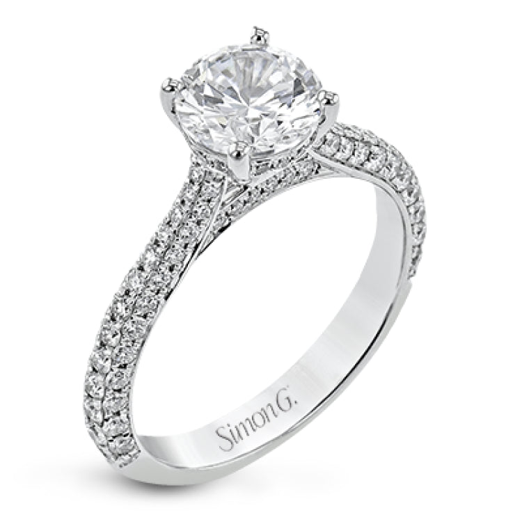 This stunning 18K engagement ring has pave set diamonds of 0.66 ctw., on all 3 sides for a sleek look