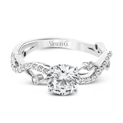 A modern, unique design, this 18k gold engagement ring featuring an intertwined design set with .22 ctw of white diamonds.
