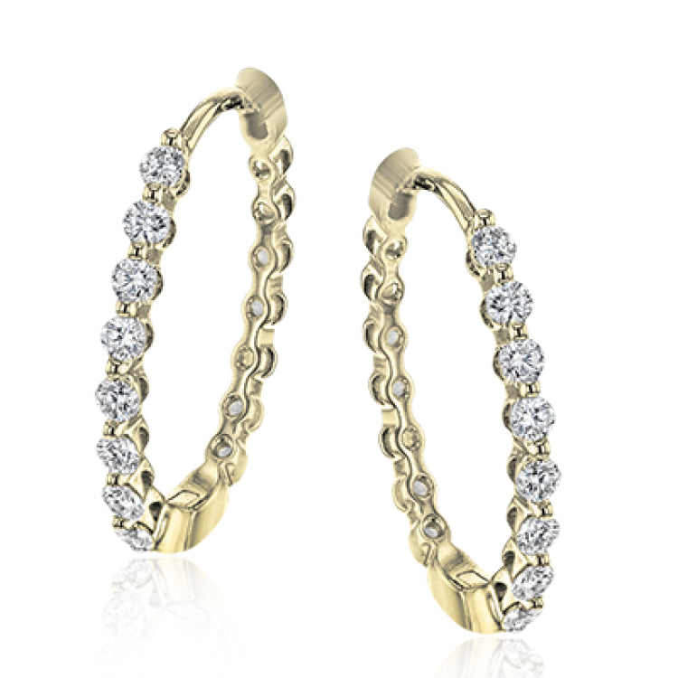 This pair of 18k yellow gold hoop earrings are the perfect size for everyday wear, and shine with .33 ctw of yellow diamonds.