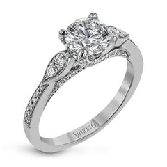 This absolutely charming white gold ring features a subtle, nature-inspired design as well as .32 ctw of round white diamonds.