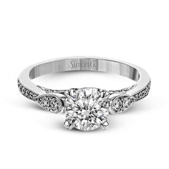 This absolutely charming white gold ring features a subtle, nature-inspired design as well as .32 ctw of round white diamonds.