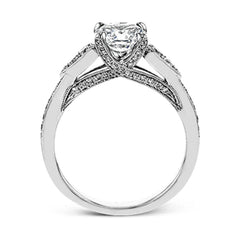 This absolutely charming white gold ring features a subtle, nature-inspired design as well as .32 ctw of round white diamonds.
