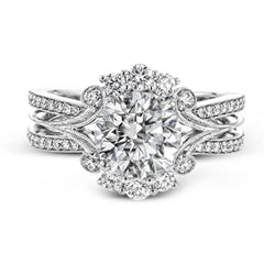 Turn heads with this stunning white gold ring that glitters with an impressive .58 ctw of round white diamond accents.