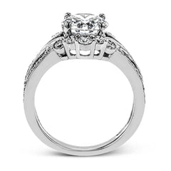 Turn heads with this stunning white gold ring that glitters with an impressive .58 ctw of round white diamond accents.