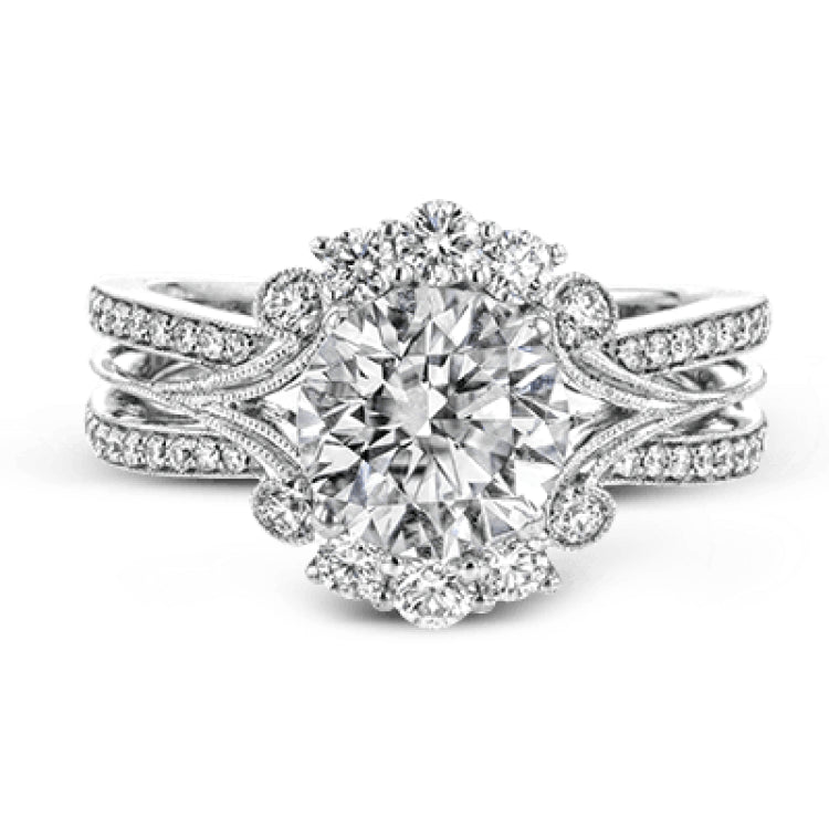 Turn heads with this stunning white gold ring that glitters with an impressive .58 ctw of round white diamond accents.