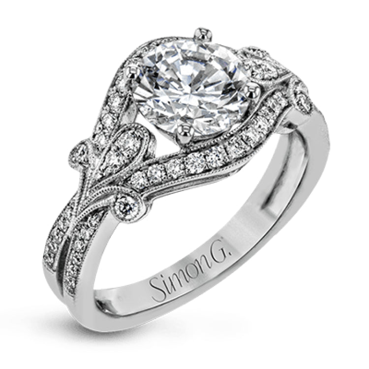 This absolutely exquisite white gold engagement ring dazzles the eye with .38 ctw of round white diamonds in a glamorous, vintage-inspired setting.