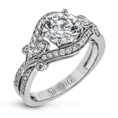 This absolutely exquisite white gold engagement ring dazzles the eye with .38 ctw of round white diamonds in a glamorous, vintage-inspired setting.