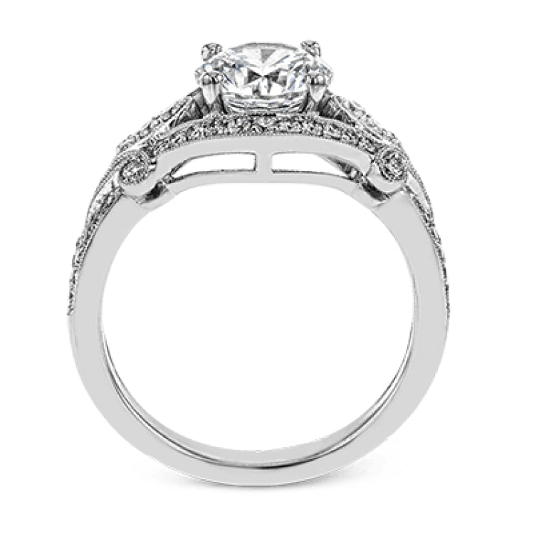 This absolutely exquisite white gold engagement ring dazzles the eye with .38 ctw of round white diamonds in a glamorous, vintage-inspired setting.