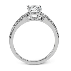 This remarkable white gold ring features .18 ctw of round white diamonds and delicate milgrain edging for a sleek, romantic look.