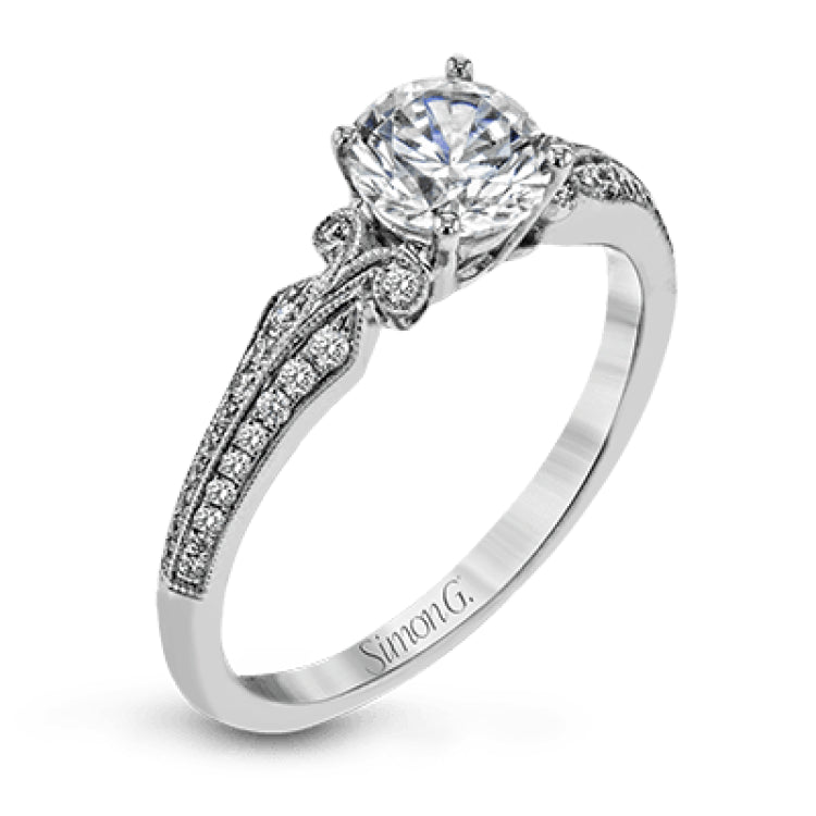 This remarkable white gold ring features .18 ctw of round white diamonds and delicate milgrain edging for a sleek, romantic look.