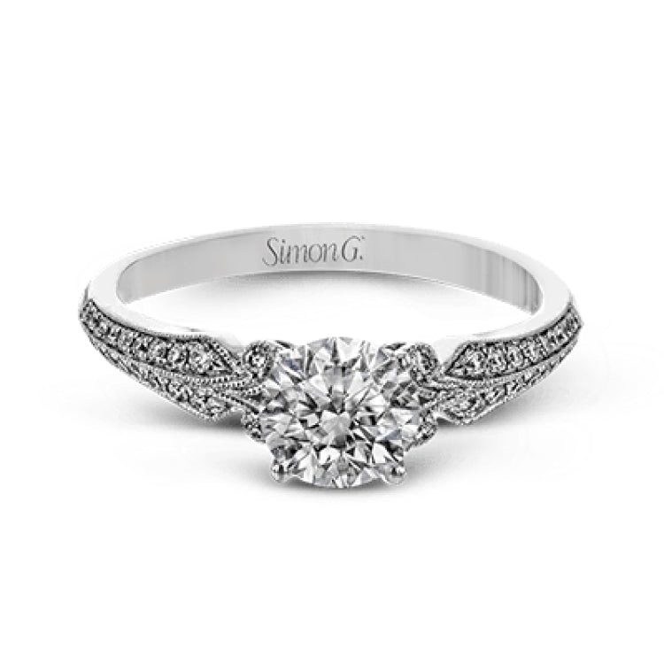 This remarkable white gold ring features .18 ctw of round white diamonds and delicate milgrain edging for a sleek, romantic look.
